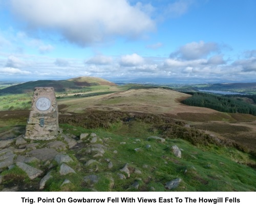 Trig point on Gowbarrow Fell with vies to the Howgill Fells