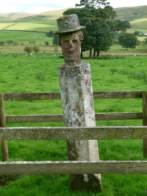 Statue in field