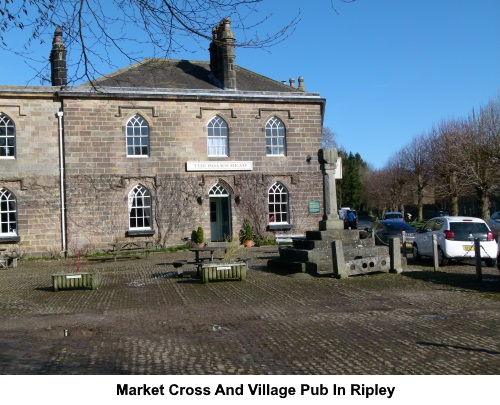Market Cross and village pub in Ripley.