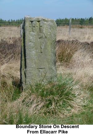 Boundary stone by the track on the descent from Ellarcarr Pike.