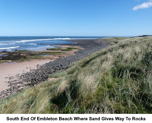 The south end of Embleton Beach where the beach meets the rocks.